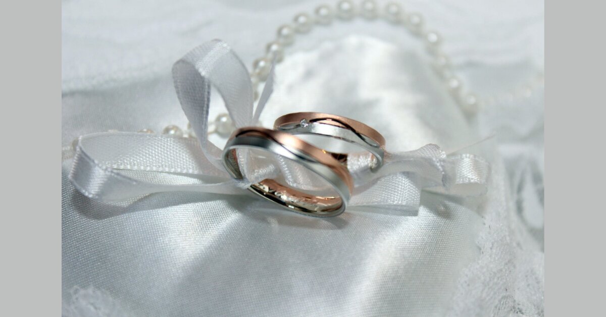a pair of rings on a while cloth
